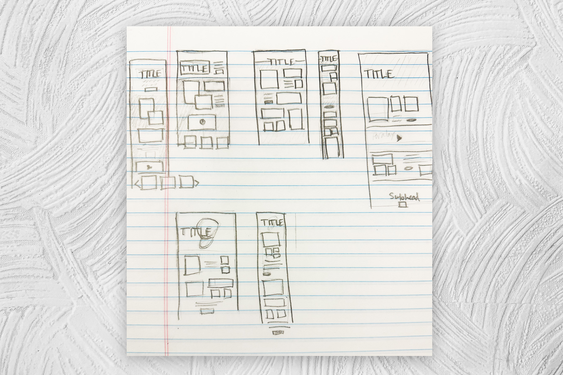 wireframe sketches on lined paper